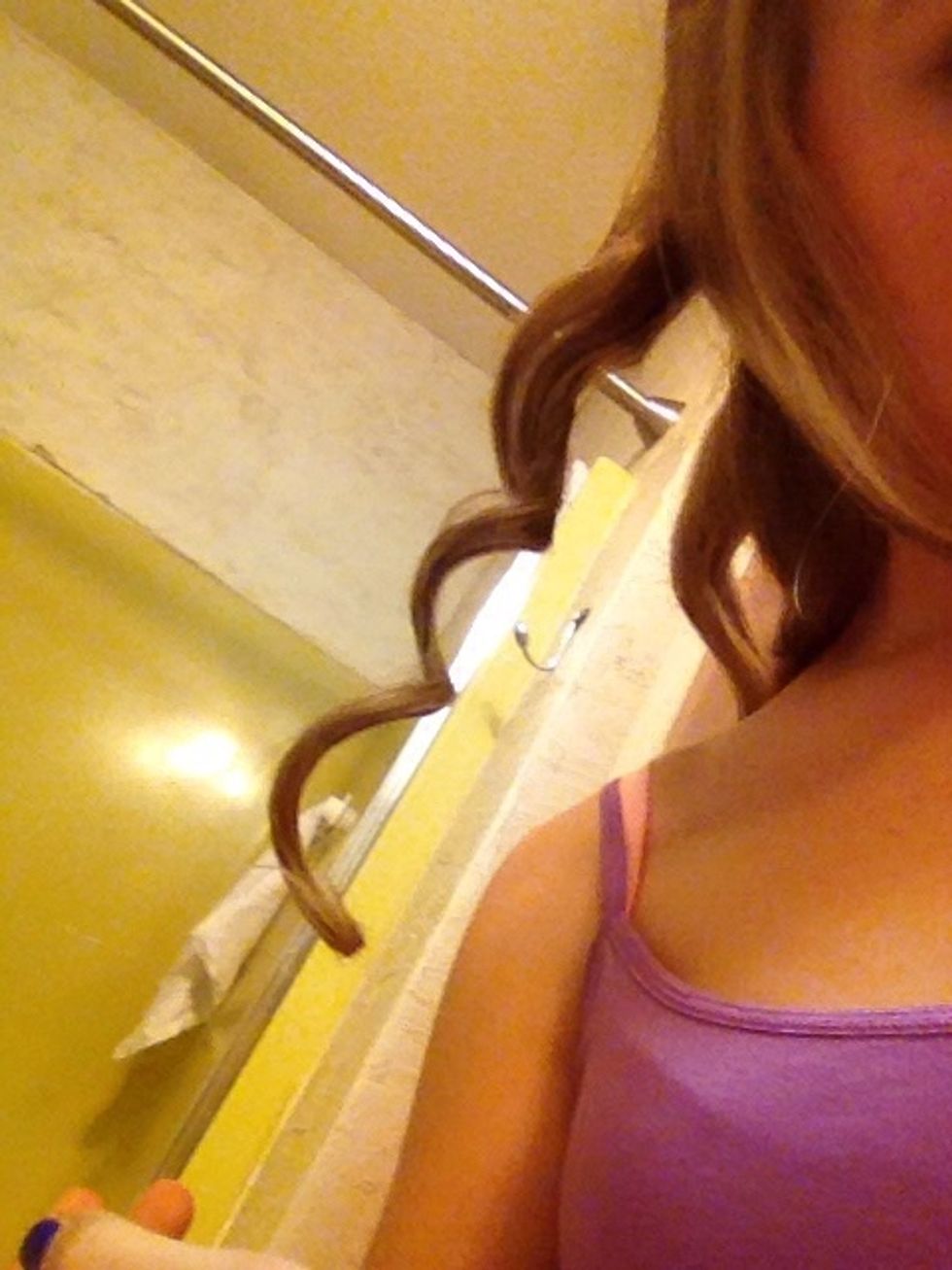 Take it out of the iron and unwind your hair and BAM you have a perfect curl.