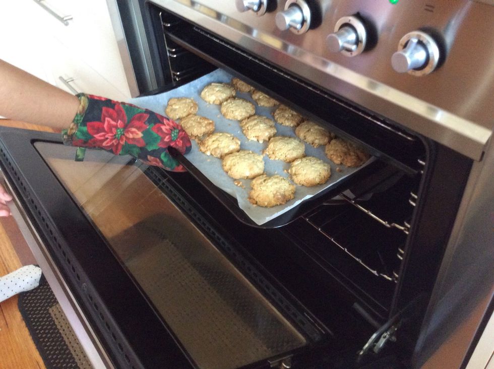 Take it out of the oven. Use a oven mitten so you don't burn yourself. Leave them to cool for around 5 minutes