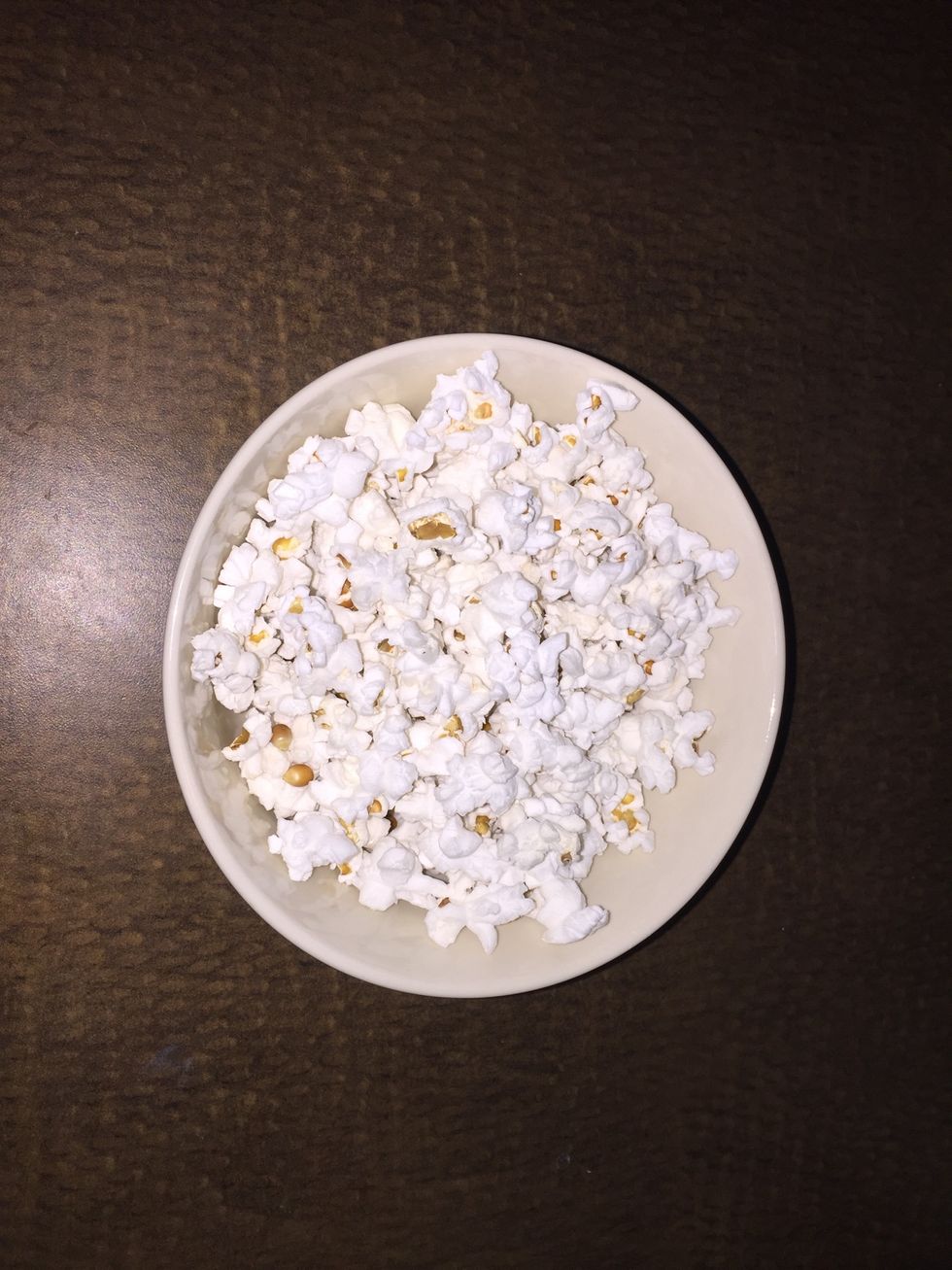 Take it out the microwave and be careful, it may be hot. Pour in a bowl. If you don't want any extra flavor on it you can stop here. If you do, proceed to the next step