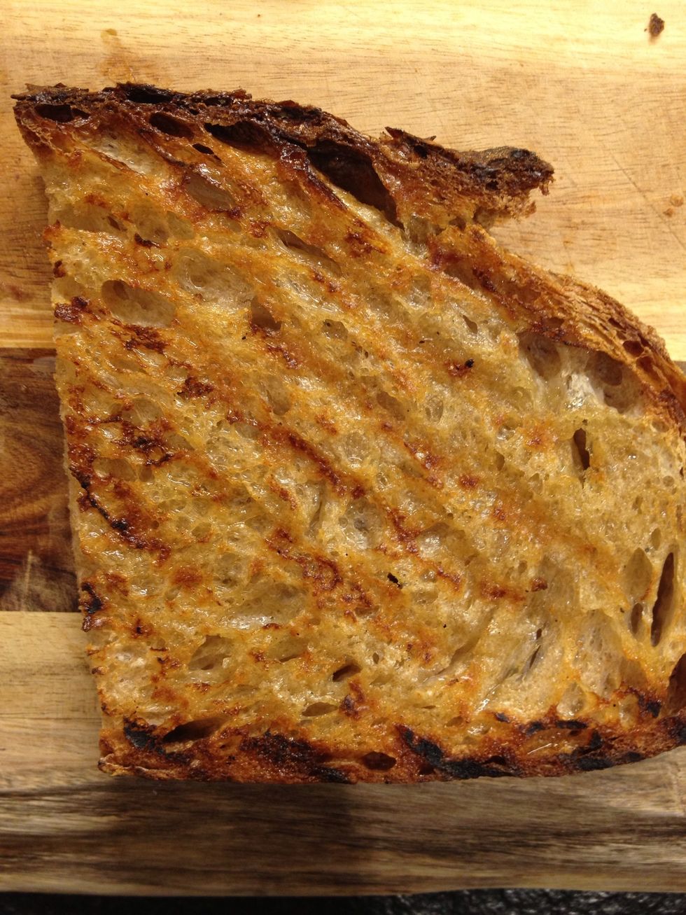 Take it out when it's just like how you want it. You can scrub a little bit of raw garlic if you want to.