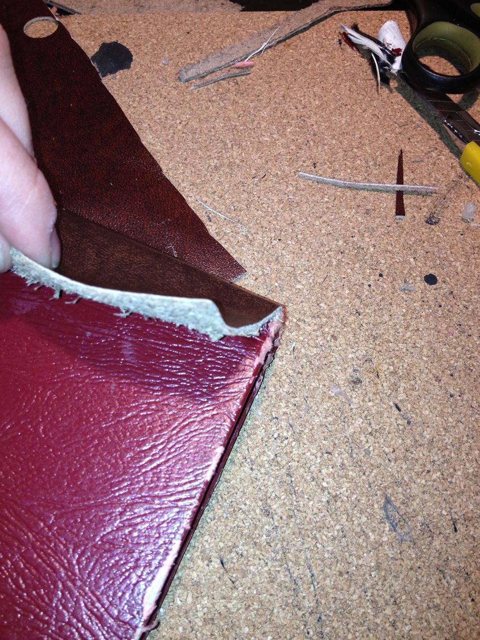 Take leather and glue it to the binding of the book. This gives the case an older unique look.