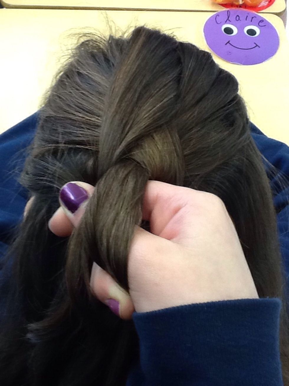 Take more hair from the head and cross the strand into the middle part
