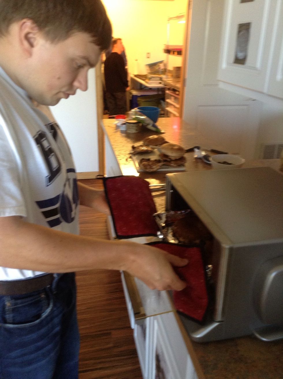 Take mushrooms out of oven using a oven mitt.