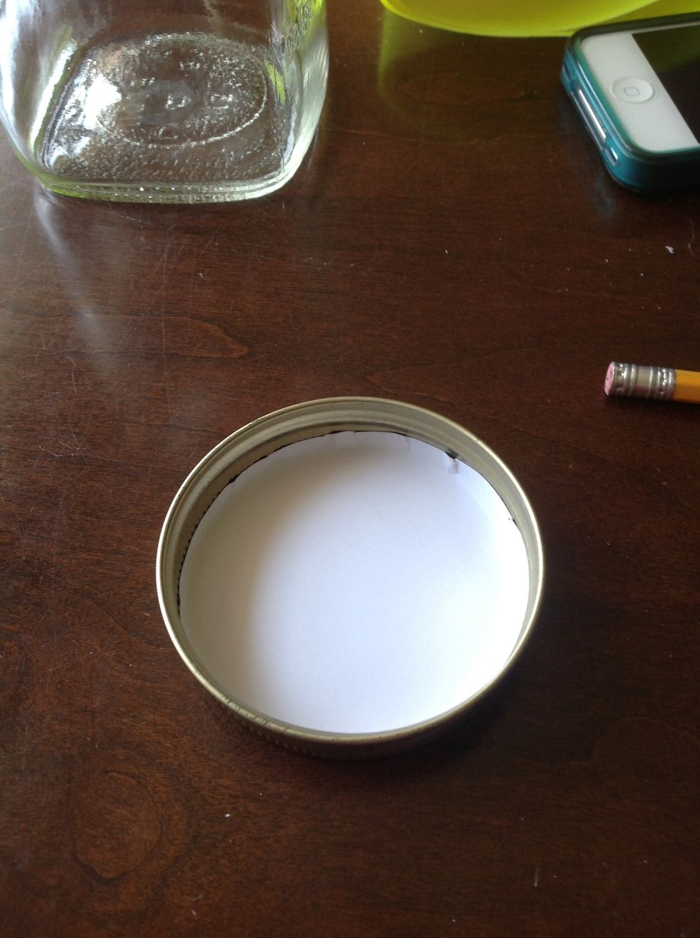 Take of and fit the paper in the in the top ring of the mason jar