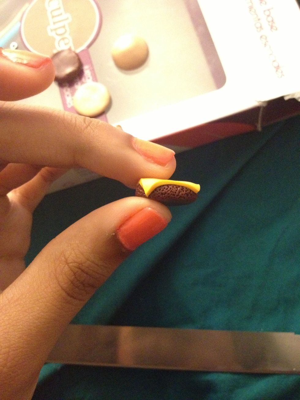 Take off the excess and roll the extra edges off of the side so it looks like the cheese is slightly melted.