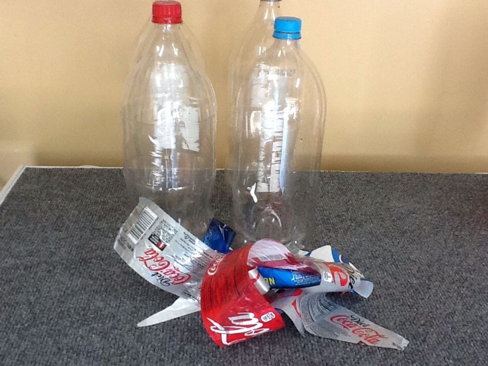 Take off the labels. Be careful not to scratch the bottles. This is the basic water treatment system. These bottles are filled with clear (more later) and then placed into sunlight for 6 hours.