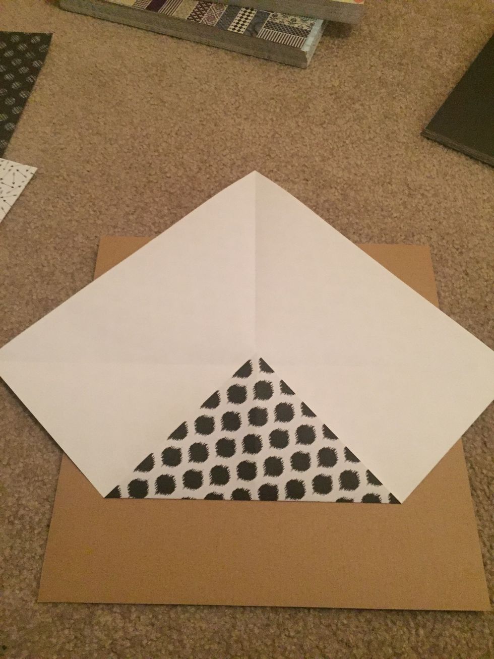 Take on corner & fold towards the center.