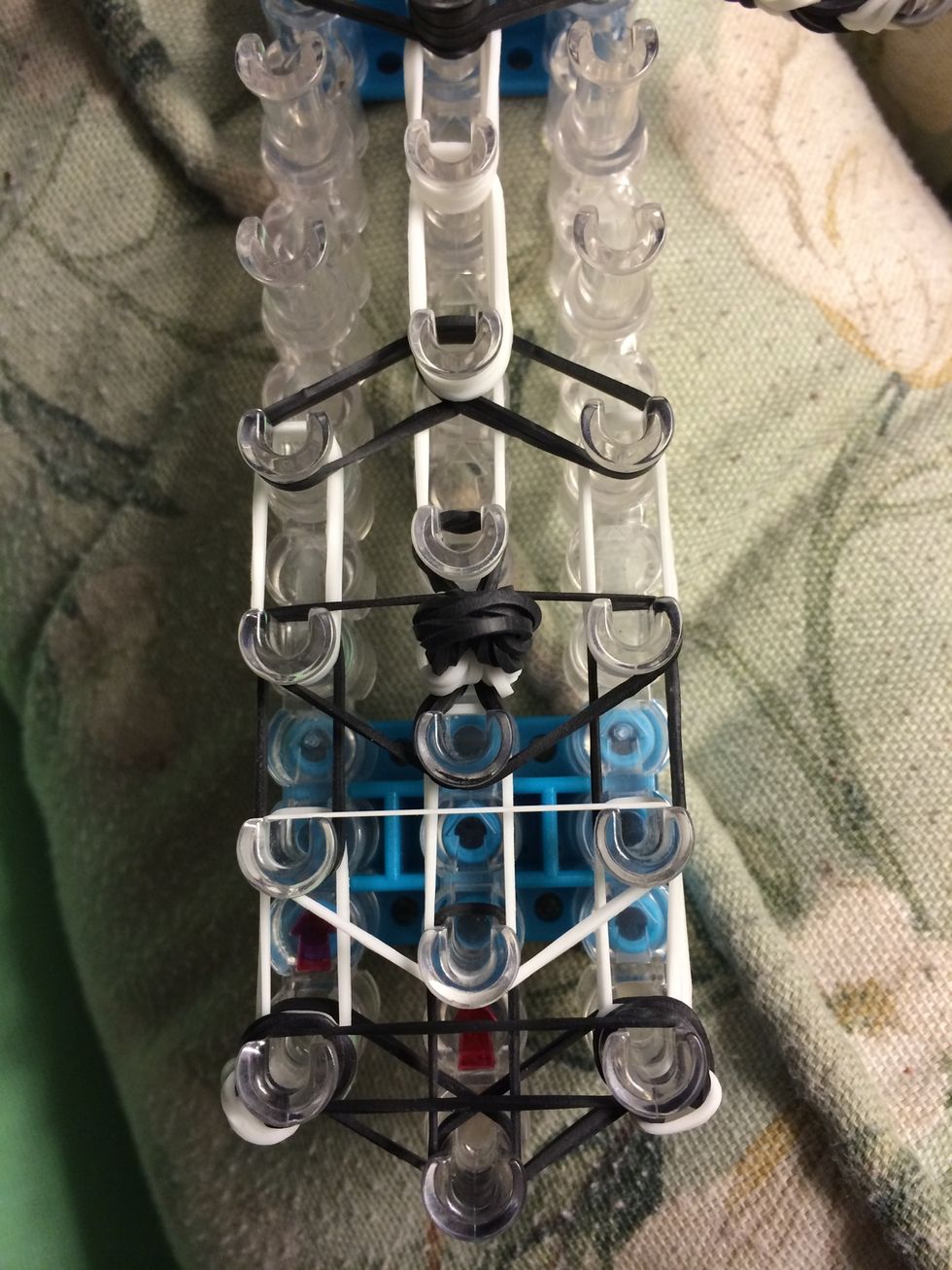 Take one black band and make another upside down triangle