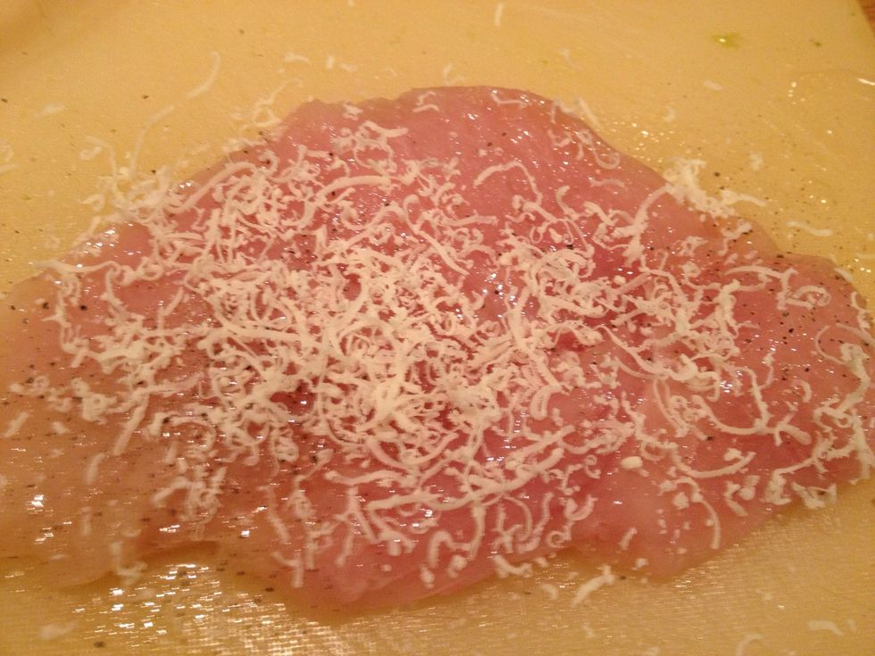 Take one chicken breast per person and bang it flat. Dip in some beaten egg (or egg white) and sprinkle with Parmesan and salt and pepper