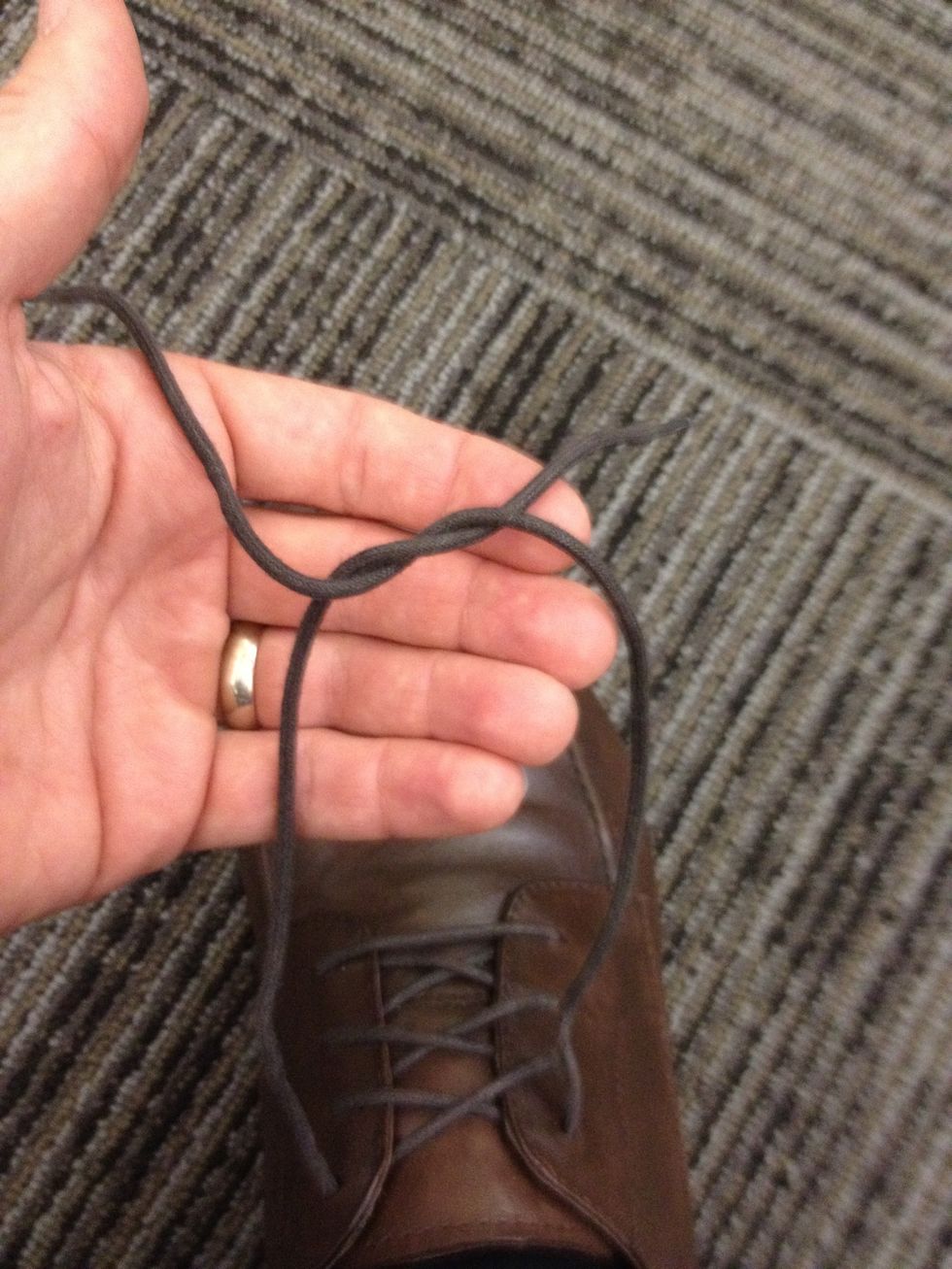 Take one end and feed through middle