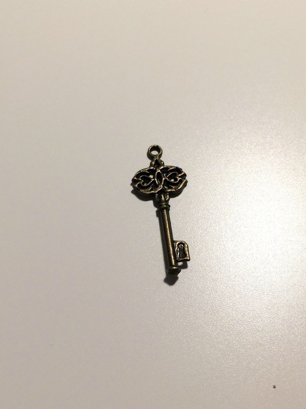 Take one key out of the ornate metal key package.