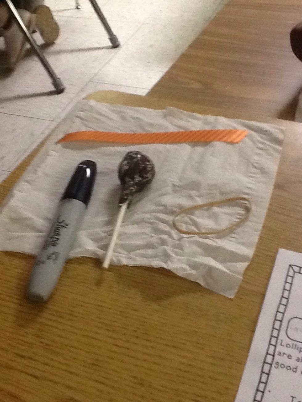 Take one lollipop and one tissue.