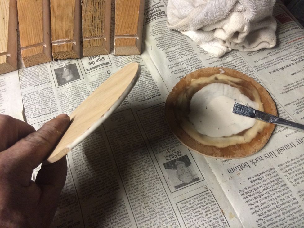 Take one of the bases and apply glue to the edge.