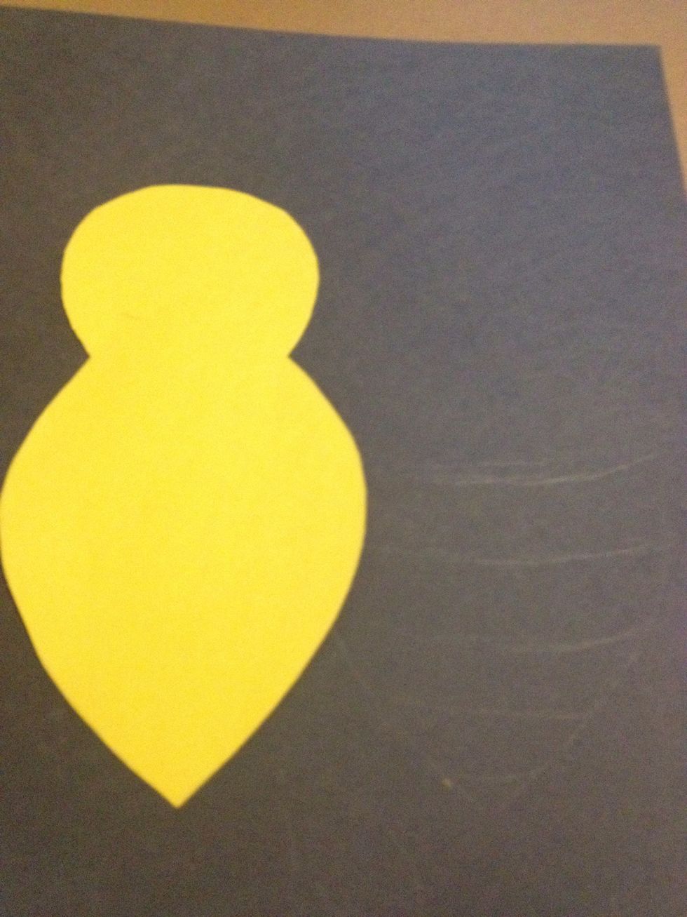 Take one of the body shapes and trace it onto black paper. Now draw some stripes on the black paper.