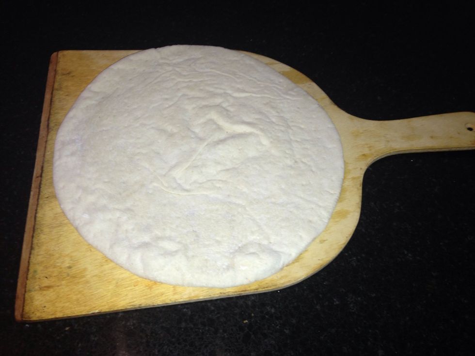 Take one of the pizza bases