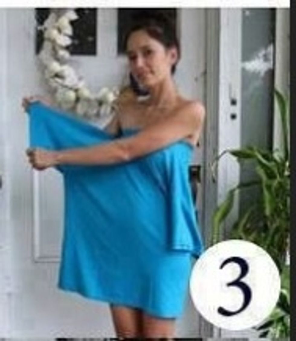 Take one of the sleeves and pull it tight out to the side.