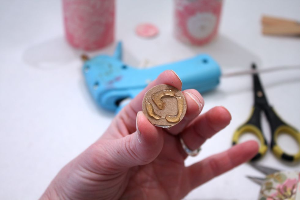 Take one of your chads and add some hot glue to the back