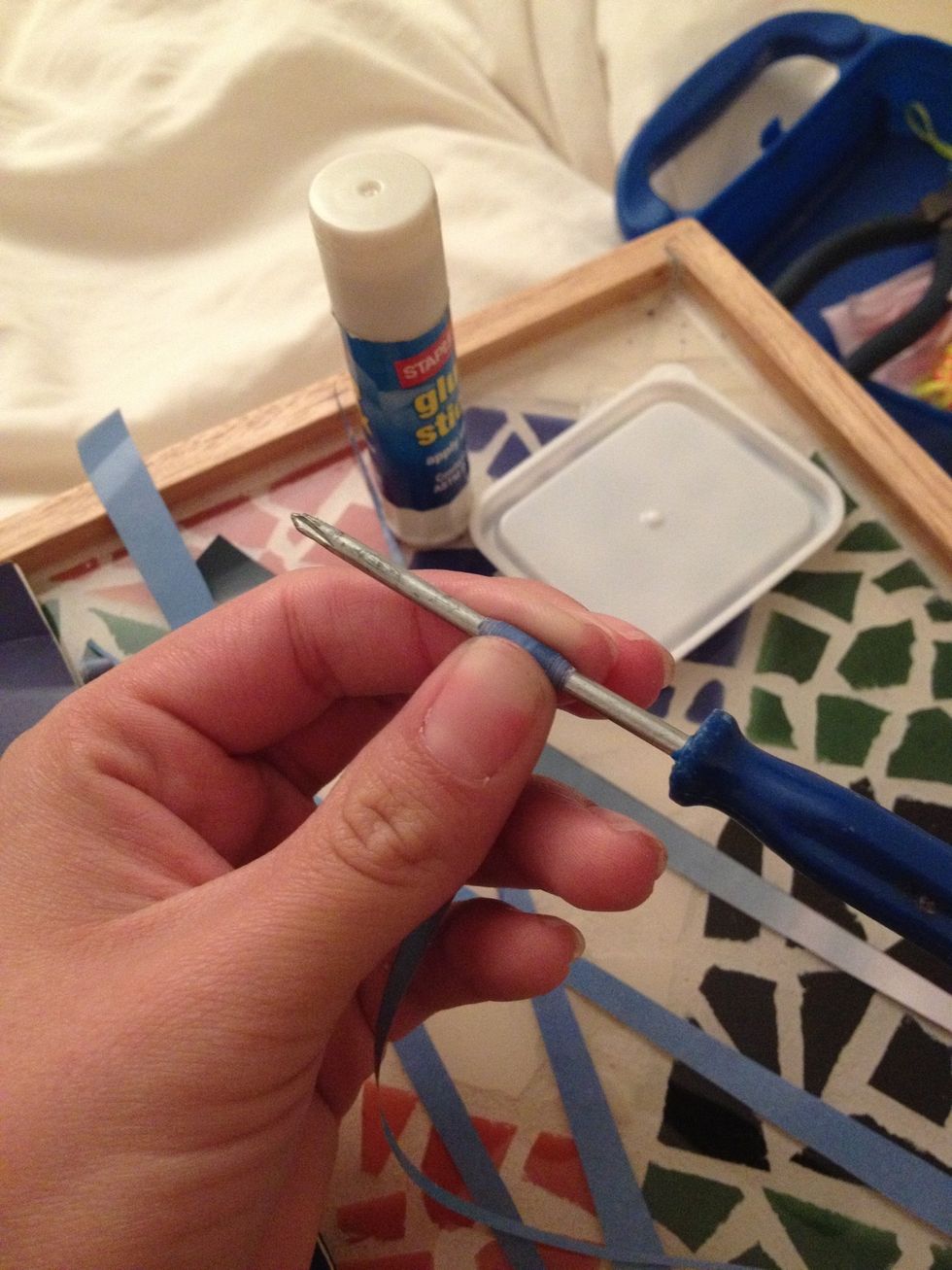 Take one of your triangles & your screwdriver or crochet needle (or whatever floats your boat) & start rolling your beads. Try to keep each bead rolling centered & rather snug to the screwdriver.