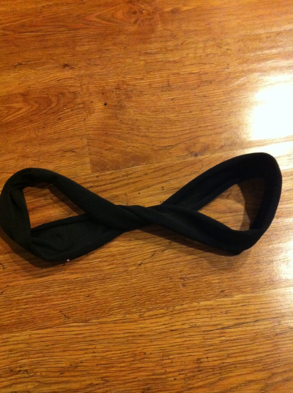 Take one portion and twist it in the position of a figure 8 and then twist it again. It is basically just 2 twist.