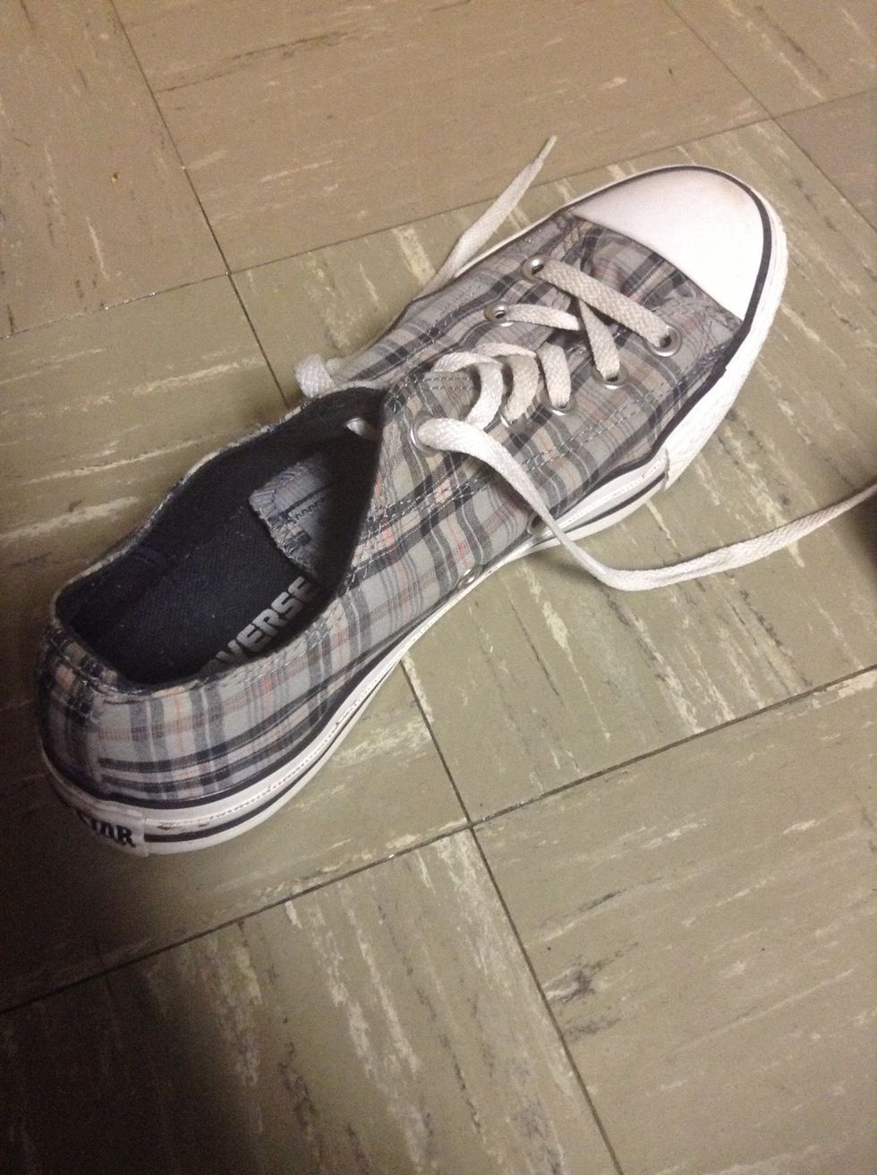 Take one shoe. Whichever one you start with is fine.