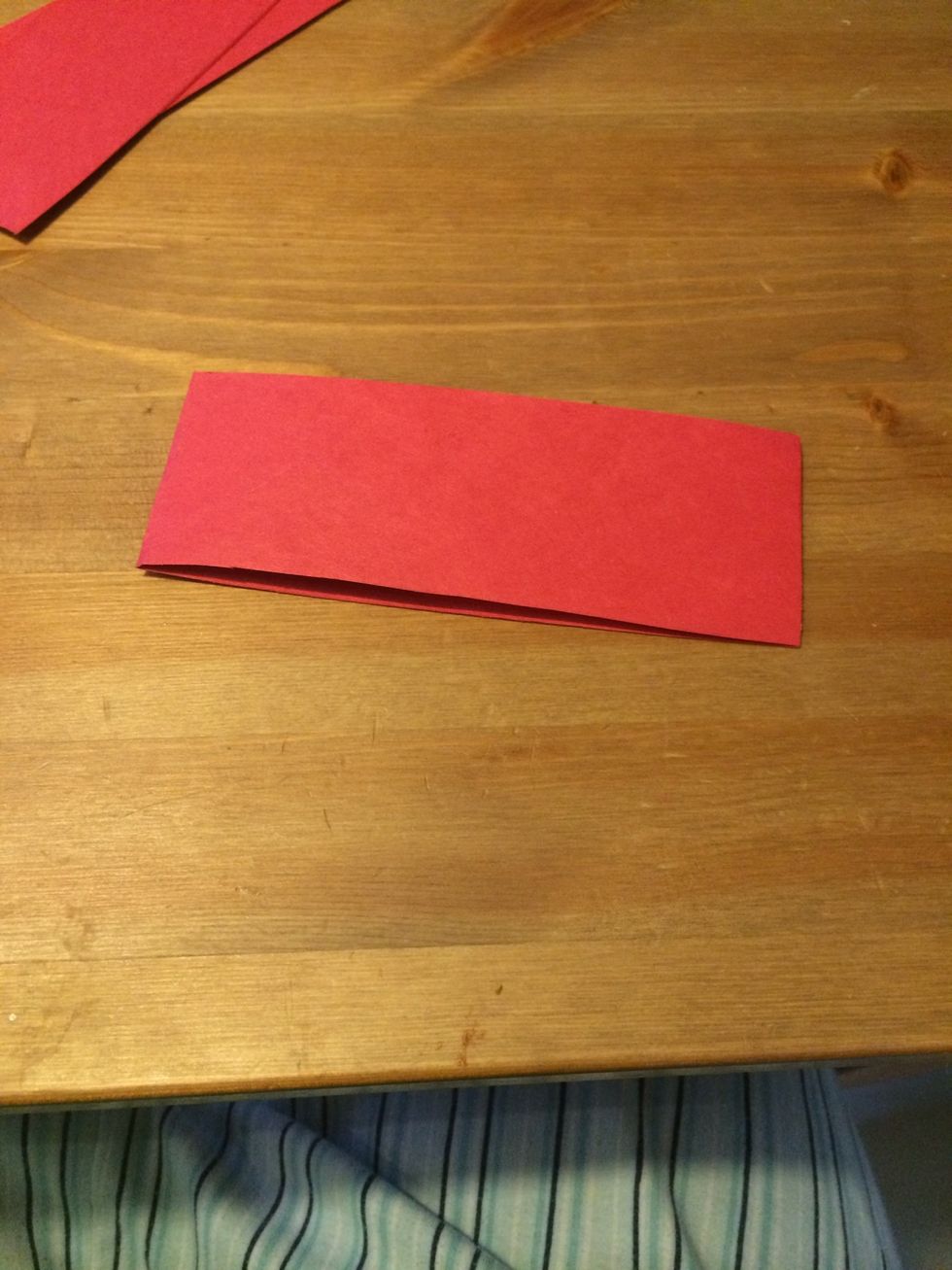Take one strip and fold it in half.
