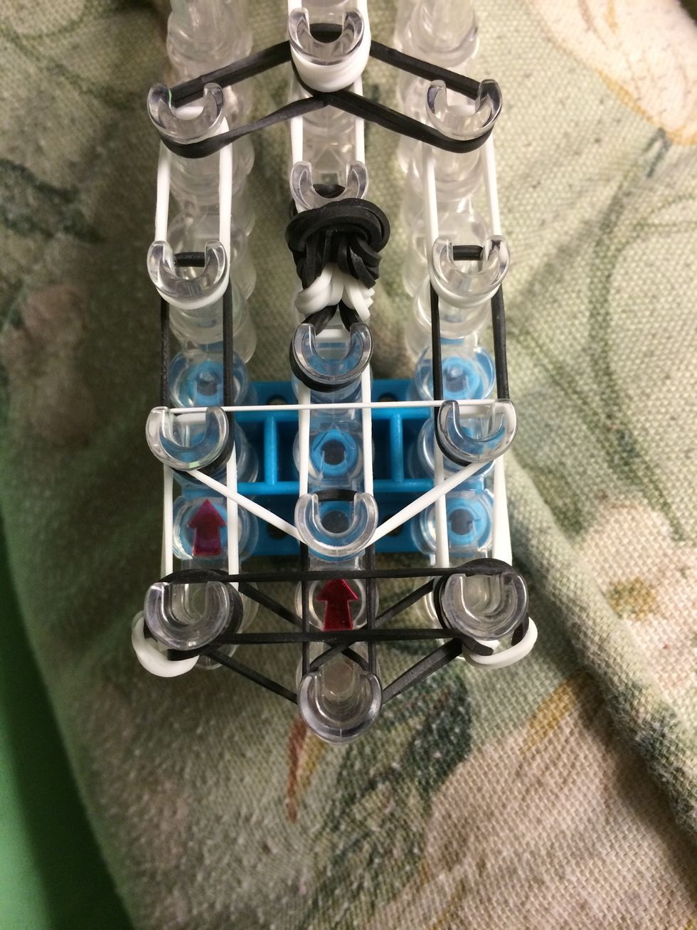 Take one white band and make an upside down triangle