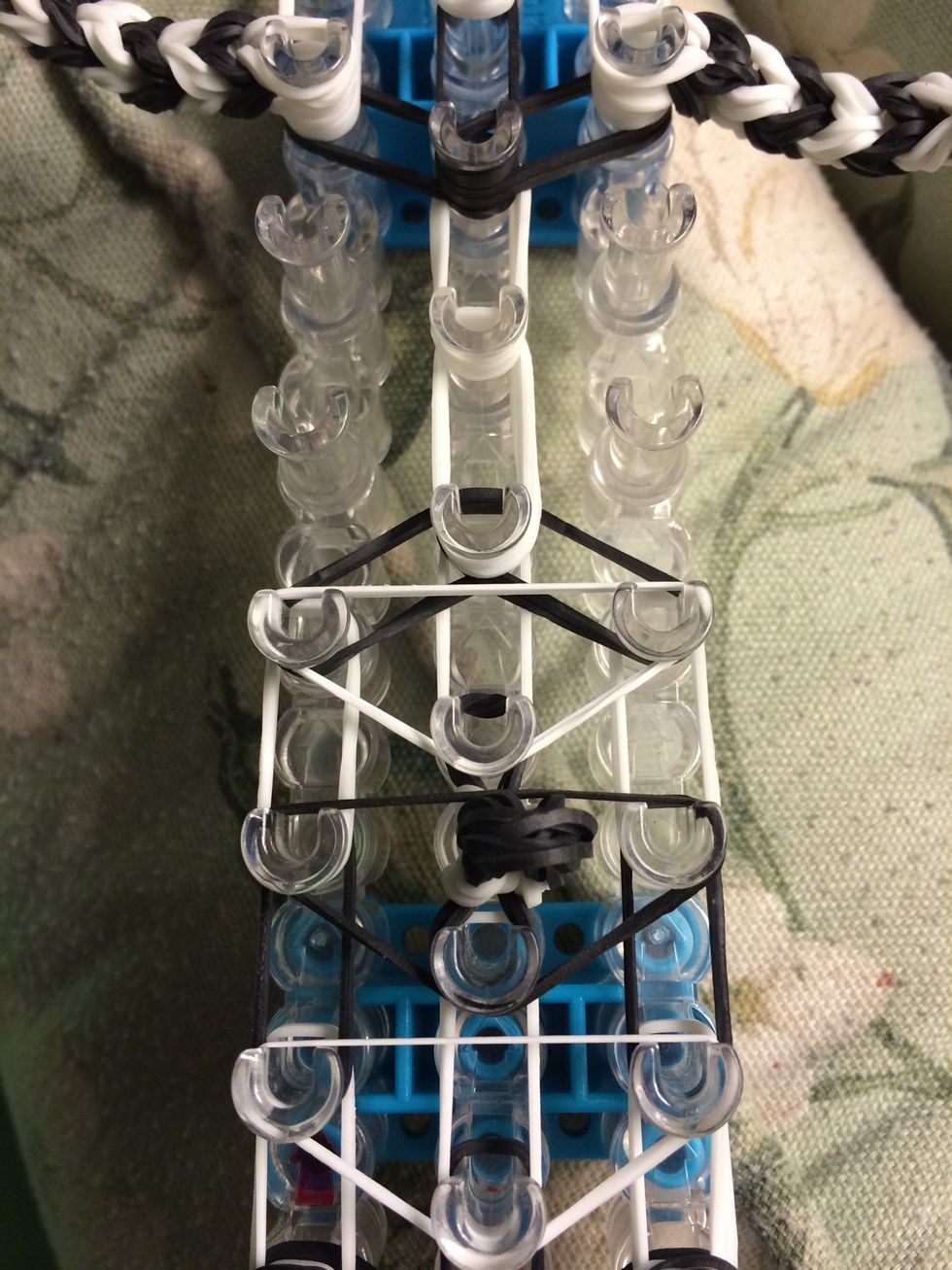 Take one white band doubled and make the last upside down triangle on the face