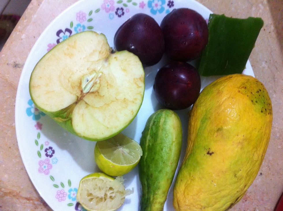 Take other fruits of ur choice. I have plums, half a mango, 1 little cucumber, half a Granny Smith apple and a lemon. You can add apricots, peaches, papaya, or even greens to make it green smoothie.