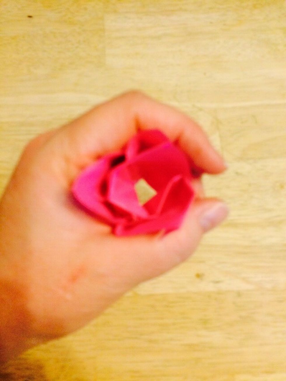 Take other hand and cup above the pinched part.