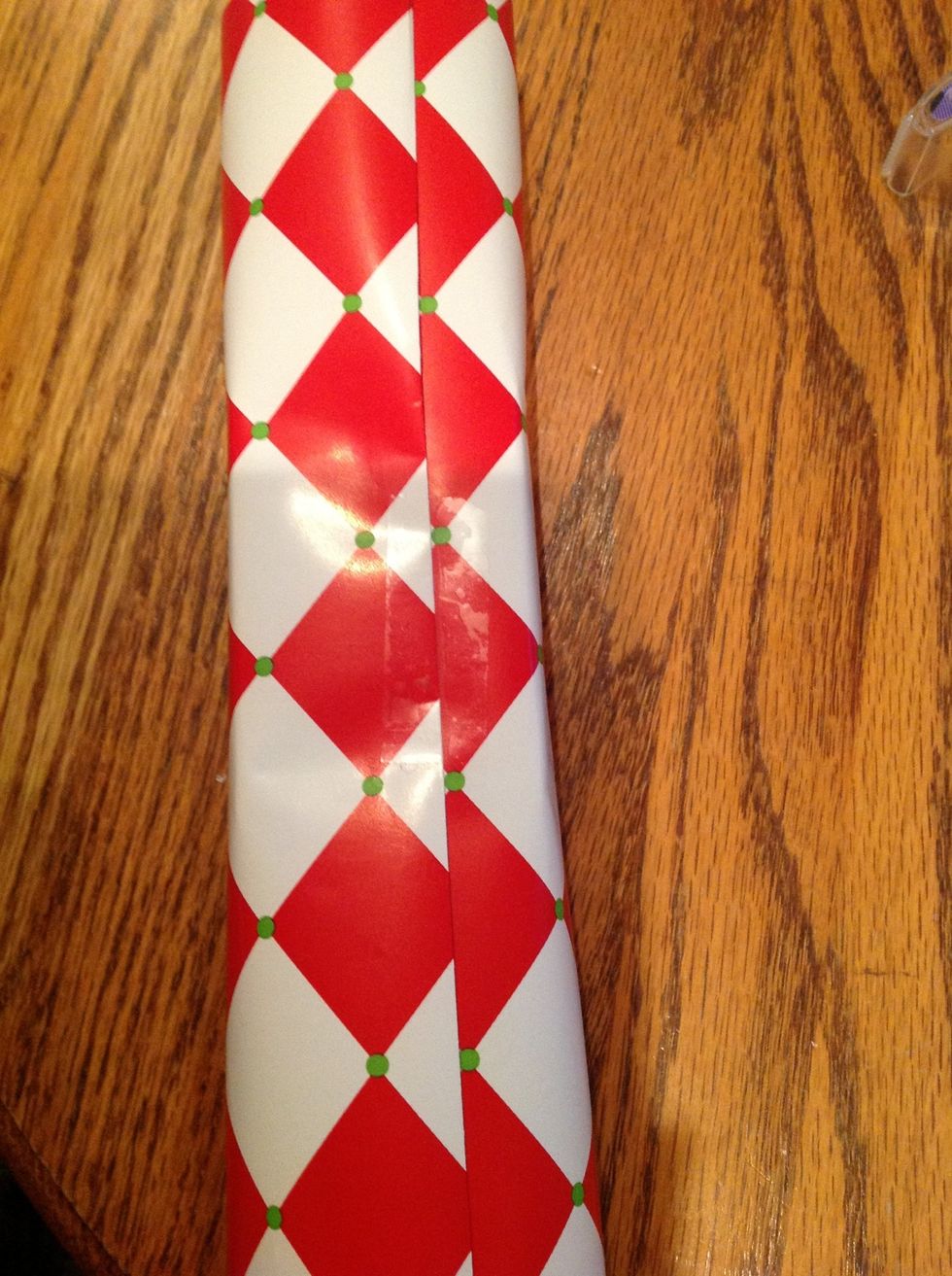 take other side, fold over the edge a little bit and bring it over. then tape it down