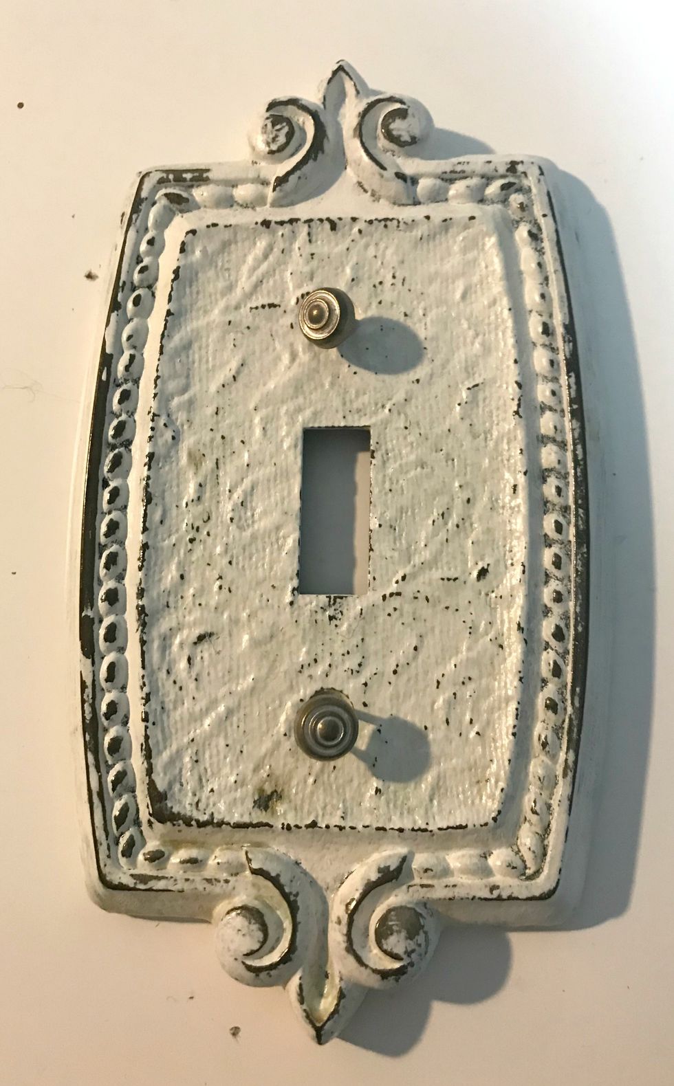 Take out 2 brads from the Shabby Chic Ornate Metal Brads package. Also grab your light plate cover.