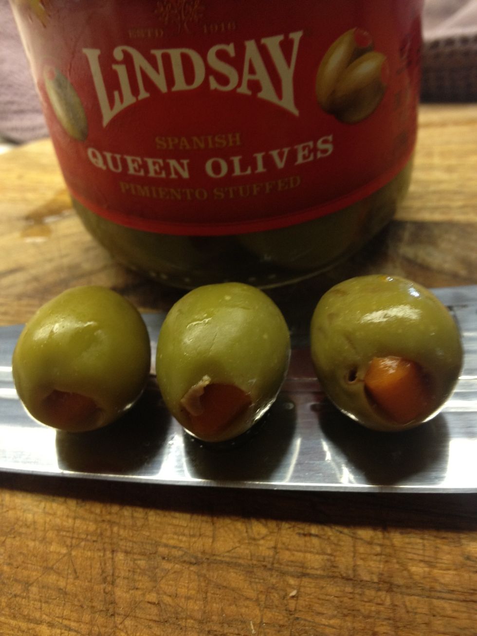 Take out 3 large Queens Olives with pimento