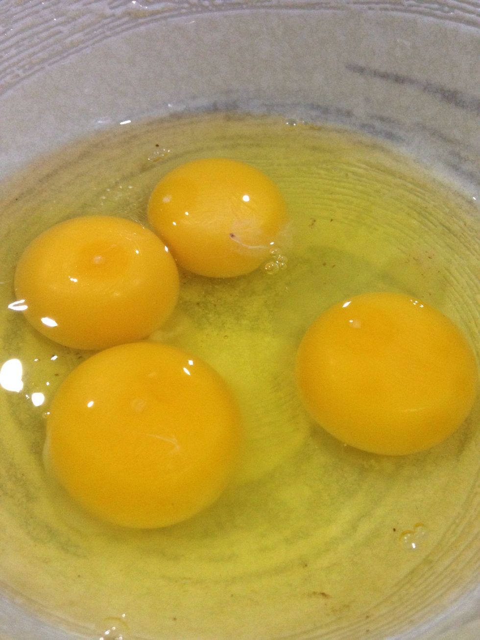 Take out 4 big eggs and beat the eggs (medium high speed)
