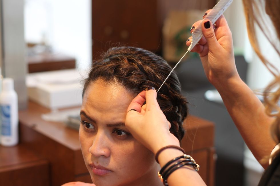 Take out a couple sections of hair to frame the face