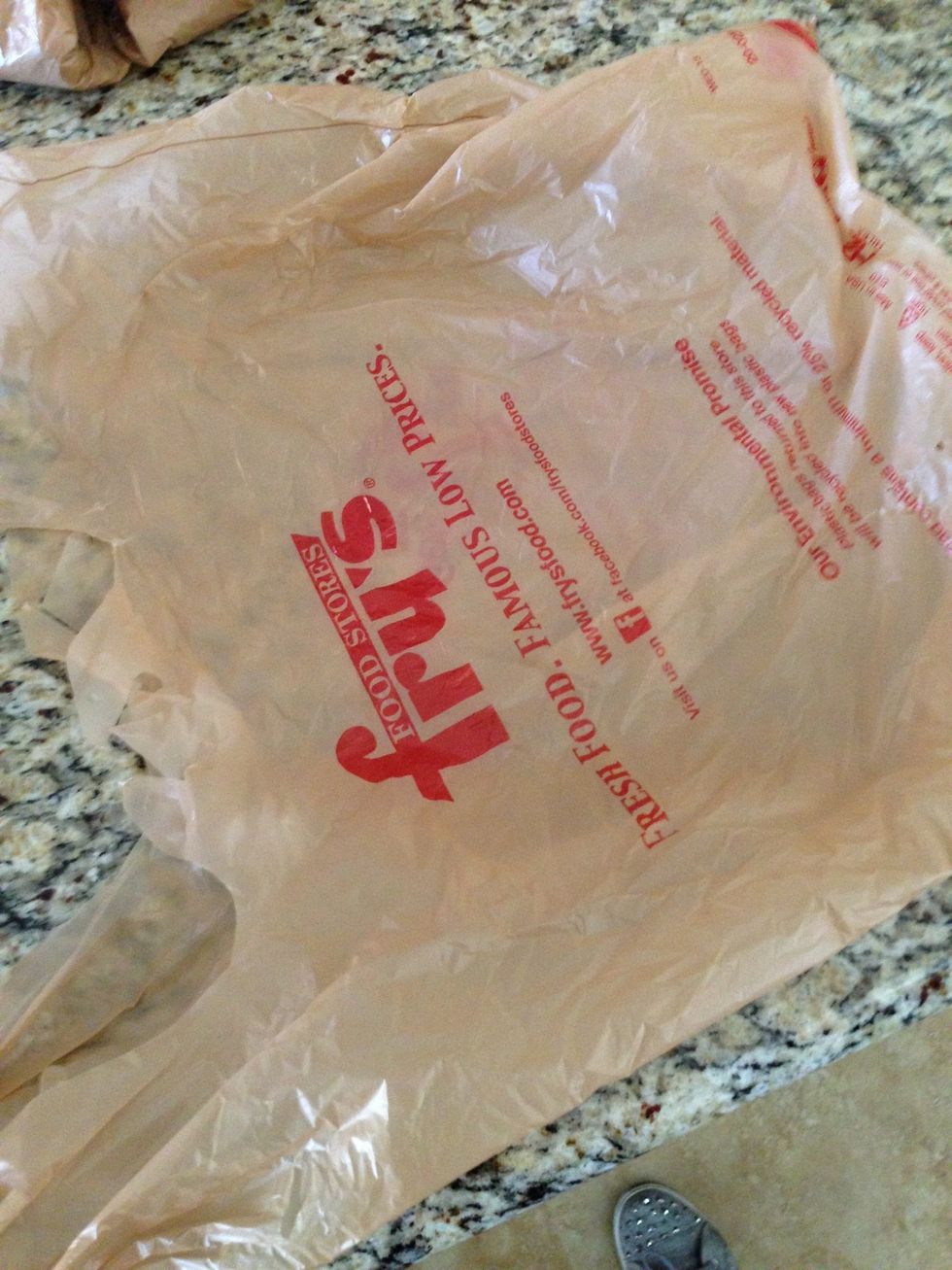 Take out a single plastic bag and put on flat surface.