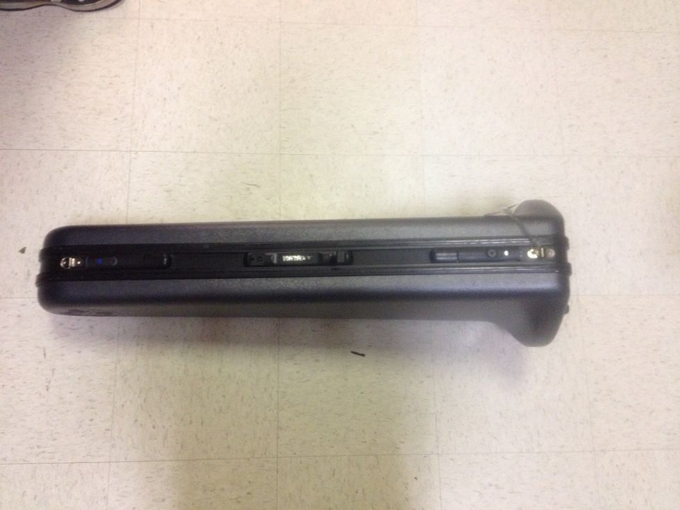 Take out case and place it on the ground with the latches on top of the case.