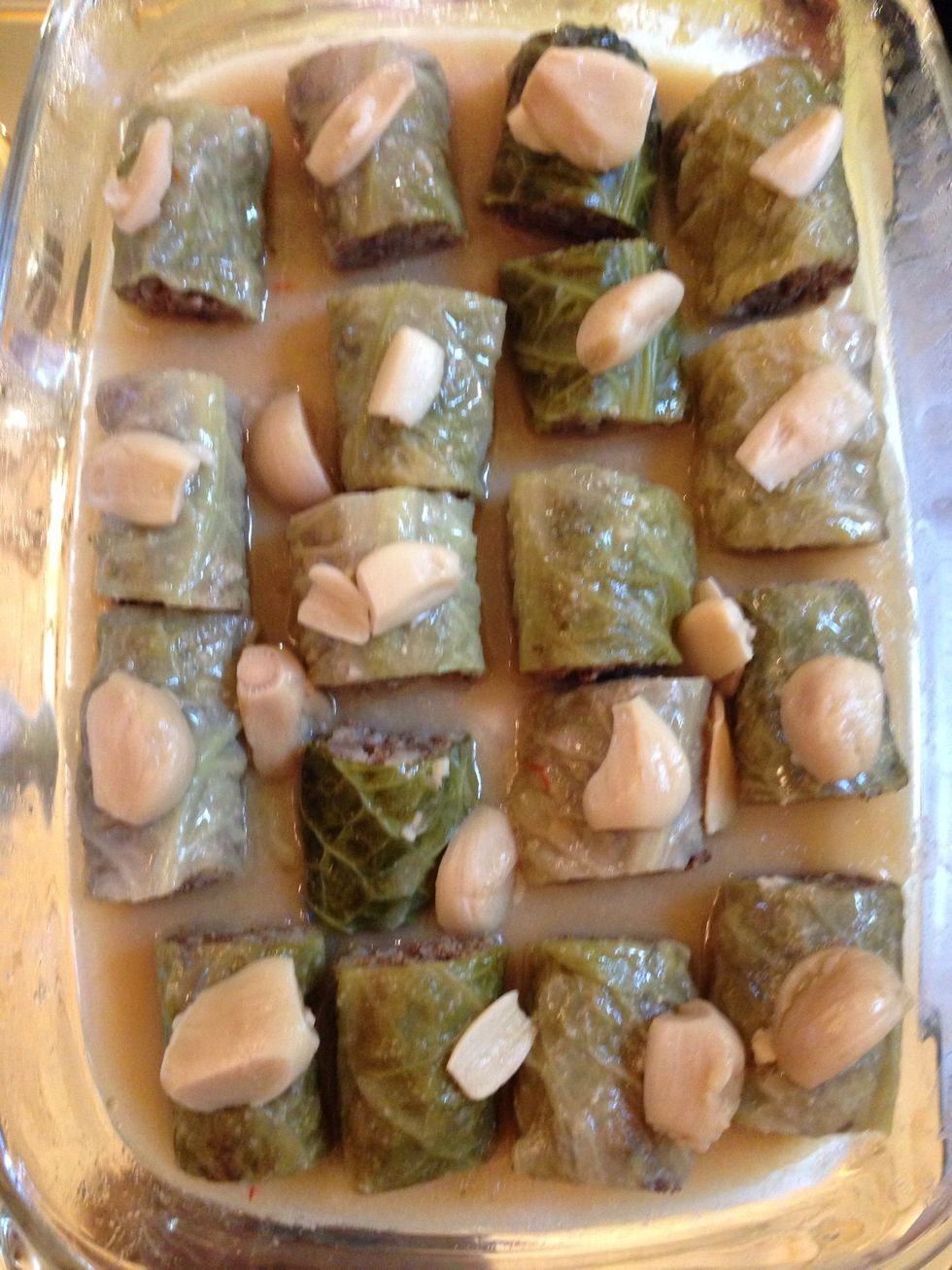 Take out. Cut the 2 ends of each rolland then in half arrange in the serving dish decorate with the cooked garlic. And add the sauce. If z sauce is too loose reduce it on high hire 10 mins