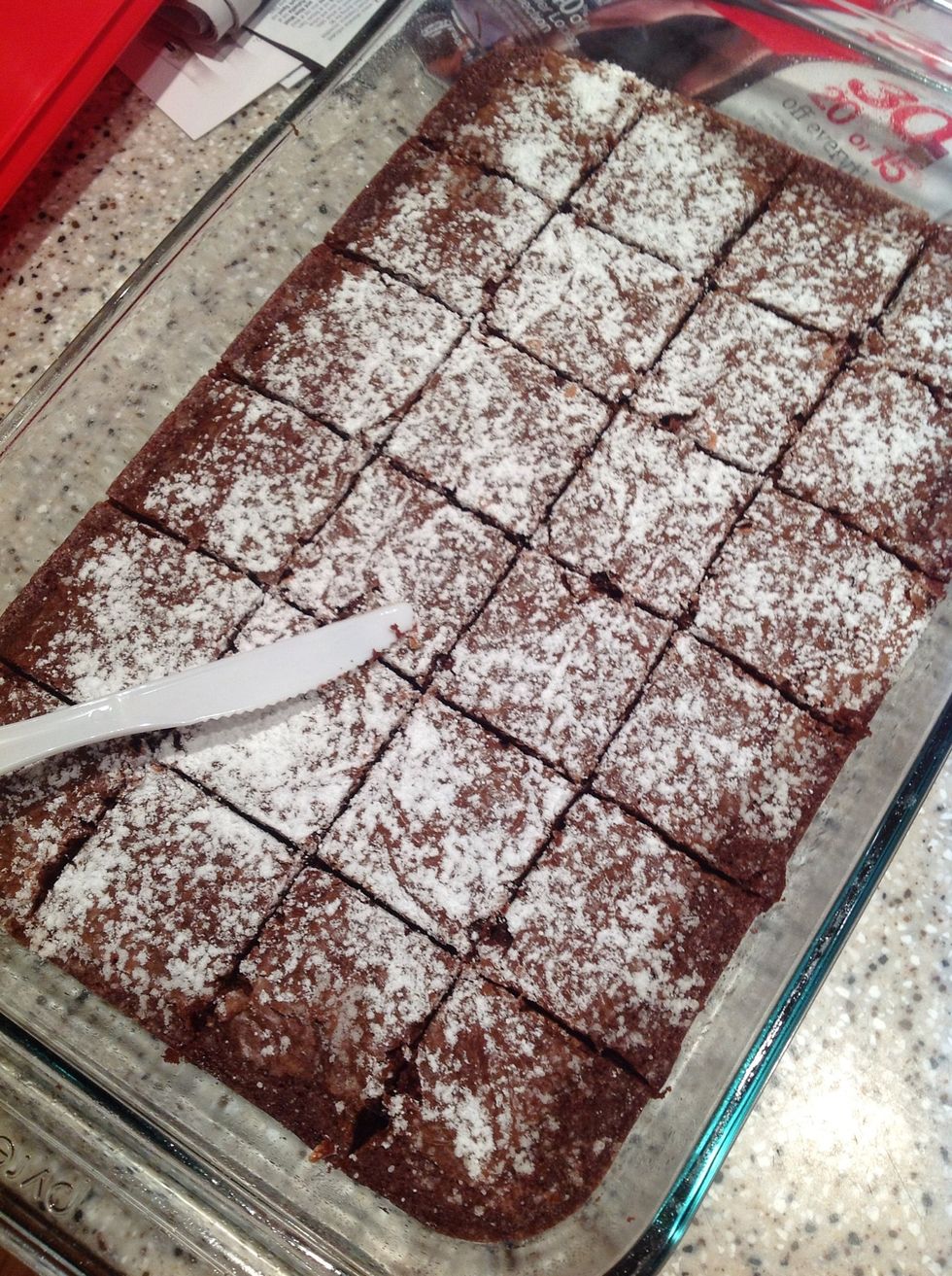 Take out knife and cut up brownies into squares.