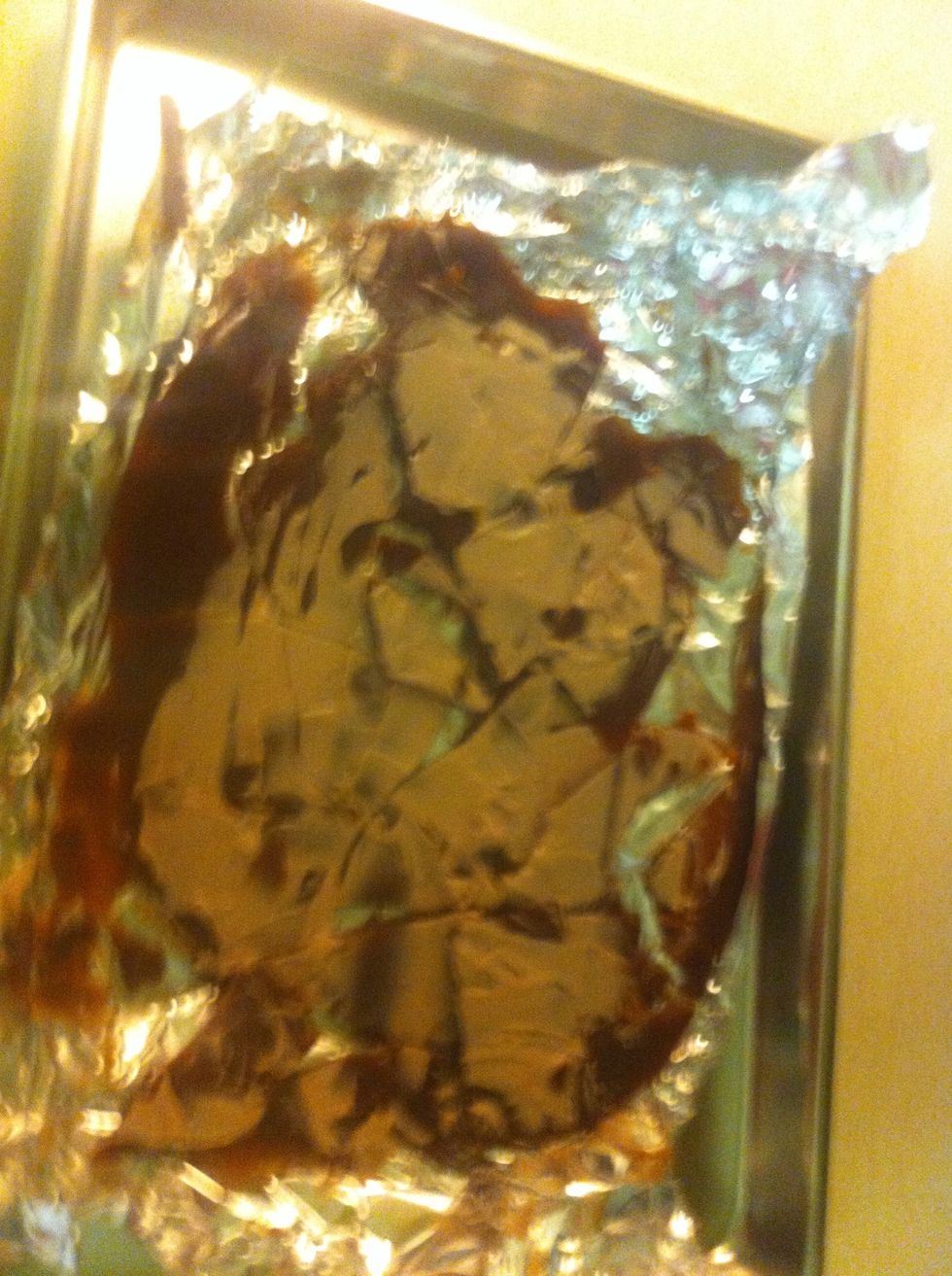 Take out of fridge and add icing or chocolate or whatever you want! Then crack from underneath the foil. (So your hands don't get super messy)