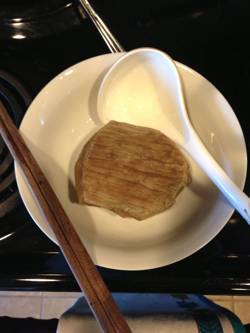 Take out the cooked meat and cut into thin slices. Put in tablespoon of chicken flavor bouillon, tablespoon of fish sauce and ( red hot sauce saut\u00e9 in oil?)