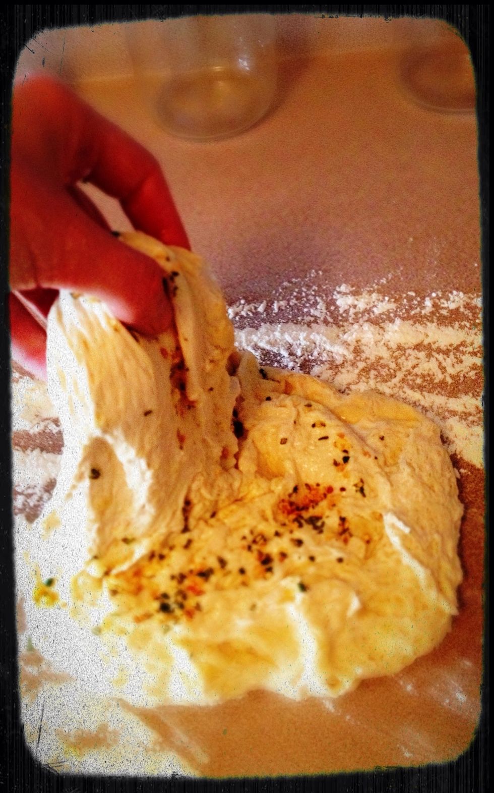 Take out the dough and fold in the rosemary and garlic.