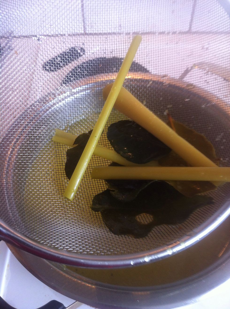 Take out the leaves as their job here is done. Let it boiled about 10 mins. At this time you can add chicken bullion and salt as needed. Keep it warm before served.