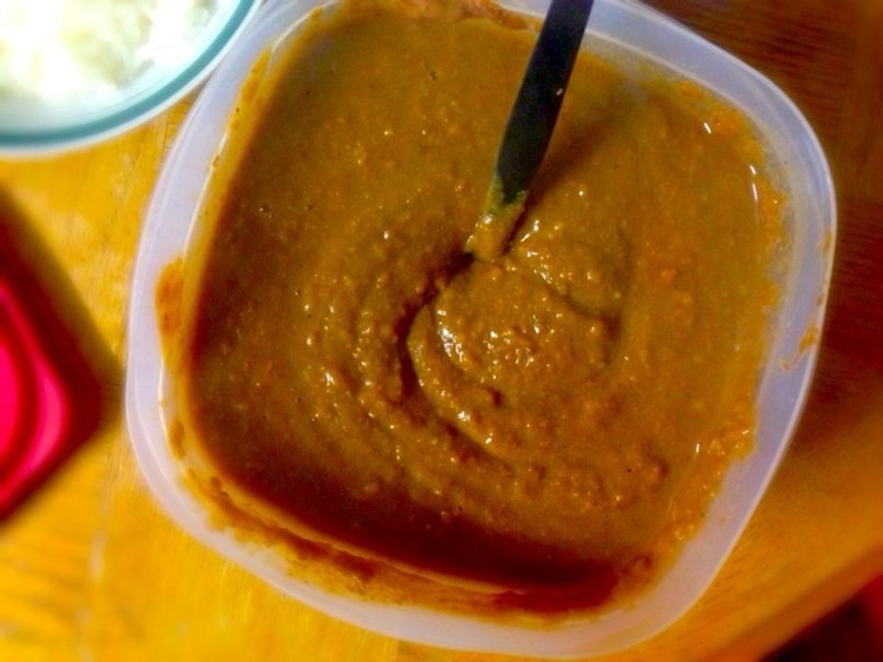 Take out the refried beans from the can and heat them up. Season with salt and pepper