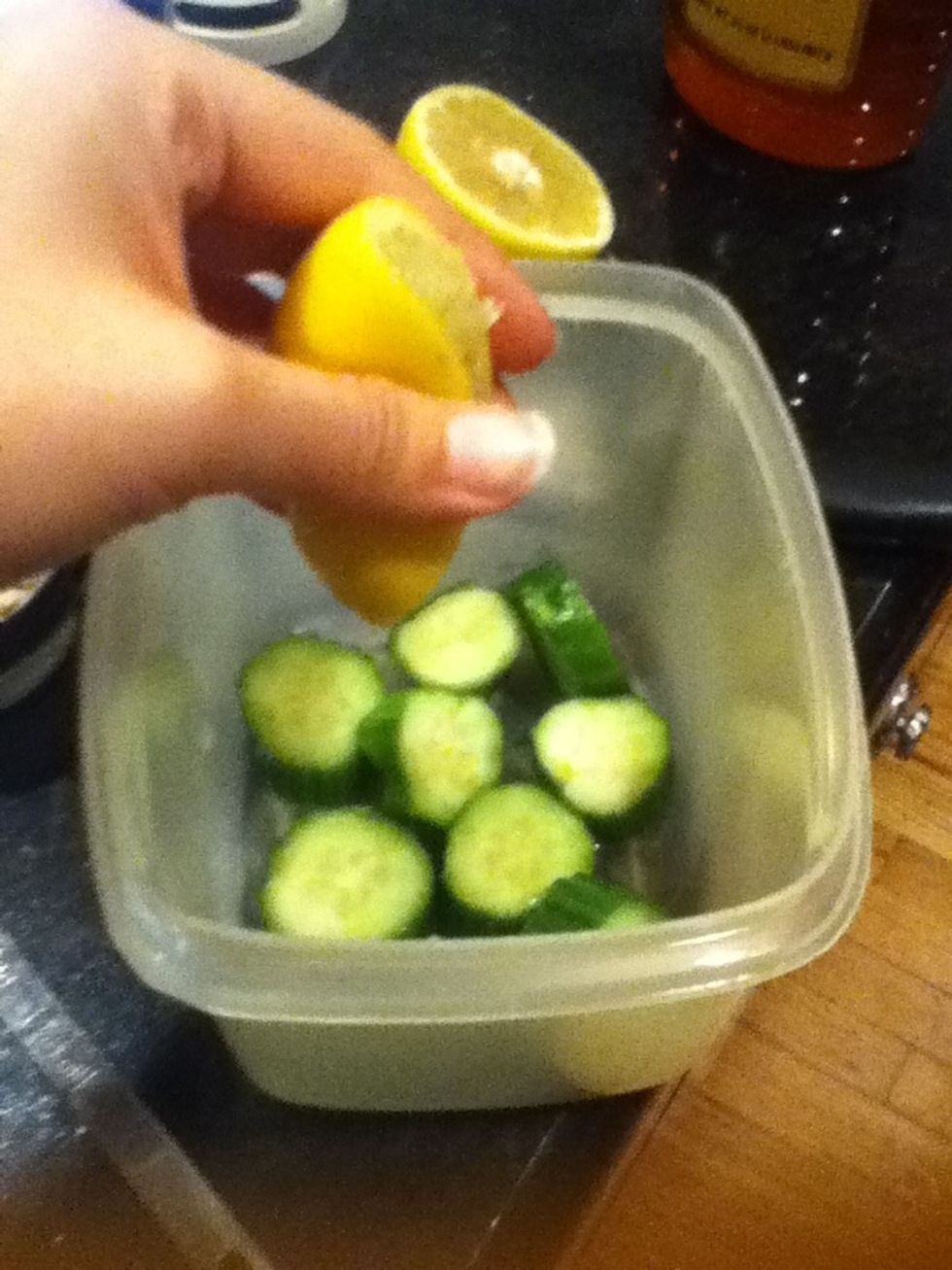 Take out the seeds and squeeze half a lemon on top of cucumbers