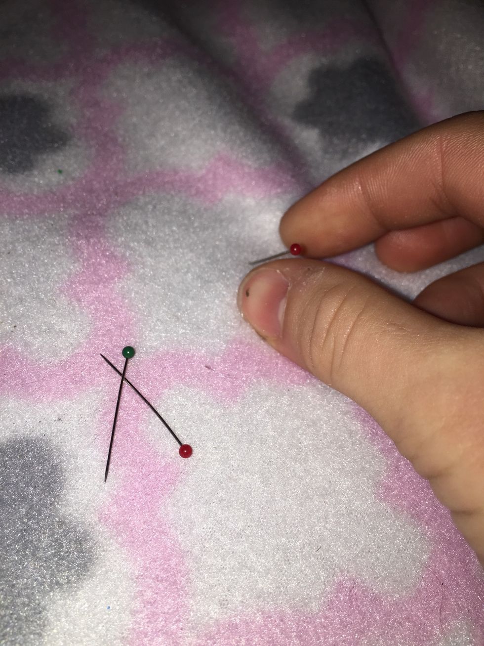 Take out the sewing pins that were holding the cloths together.
