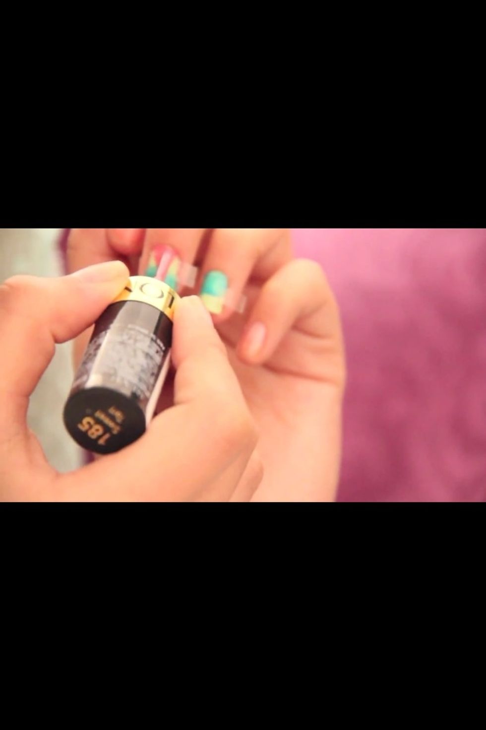 Take out the tape and put another beside the next color, paint the other side with different color .