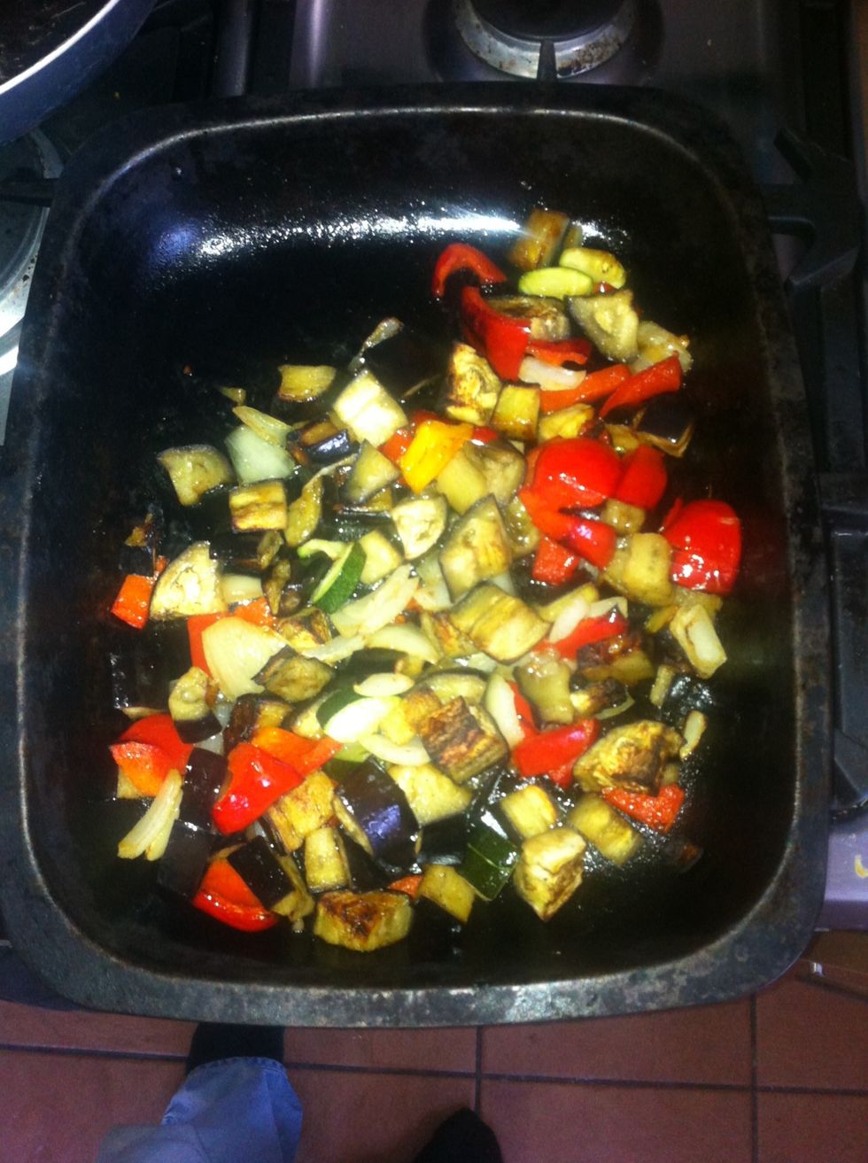 Take out the veg once it's nice and brown. A few burned bits are good! Tip the veg into the couscous and stir well.