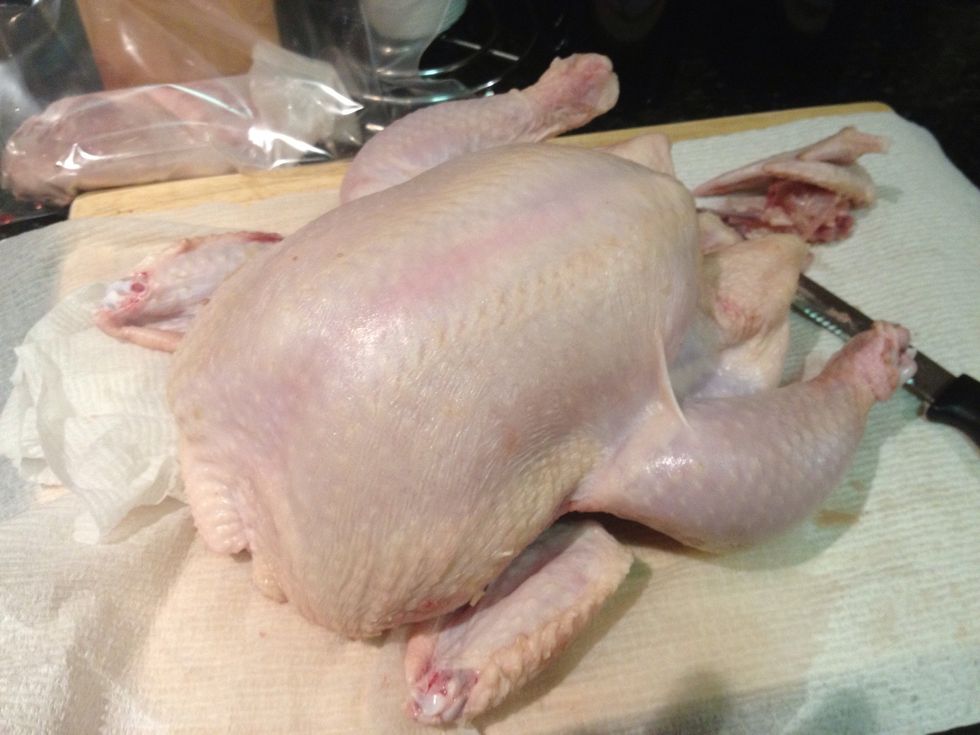 Take out your chicken. We will want this chicken trimmed meaning wing tips, guts and neckbone removed.
