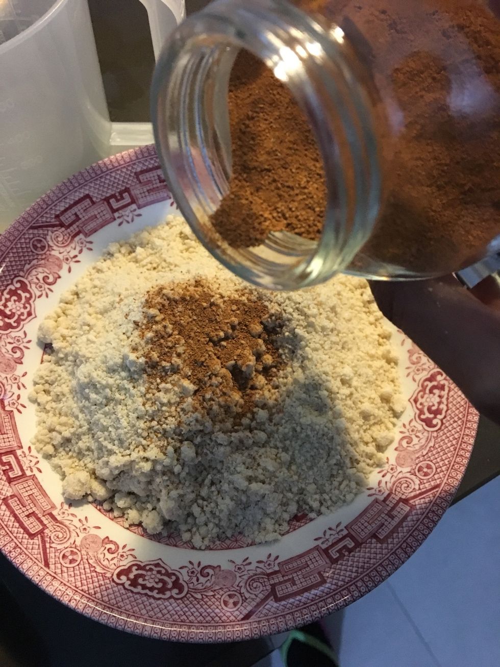 Take out your crumble mix in a bowl & add some cinnamon powder to taste