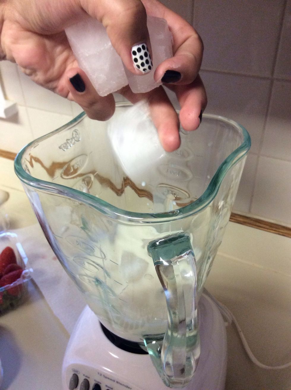 Take out your four ice cubes and place them in the blender.